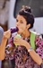A young girl has ice candy to beat the heat